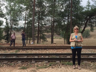 Graduate student Alana Wolf-Johnson takes site measurements at Durak station.